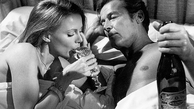 hollywood actress drinking champagne in bed with a man
