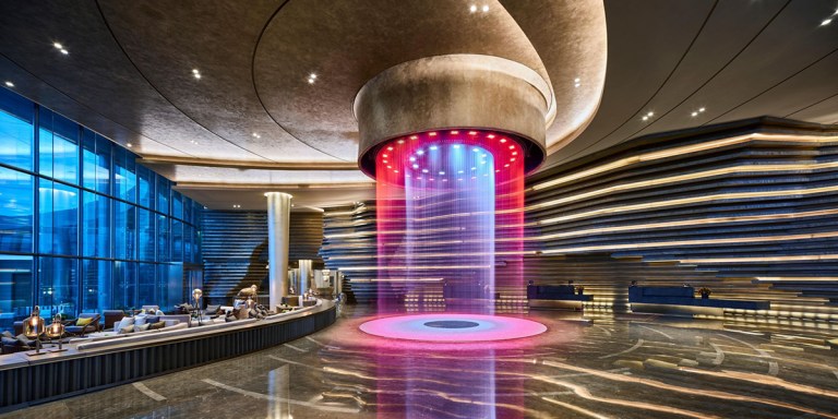 Intercontinental-Shanghai-quarry-underground-hotel-reception-design-waterfall