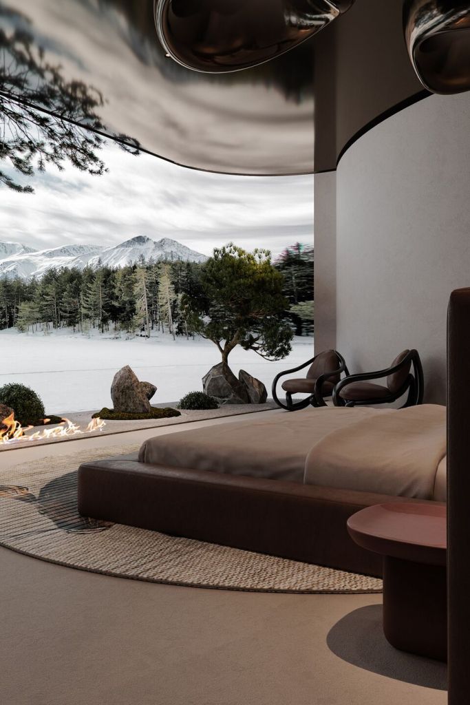 A modern bedroom with a large bed, stylish round bedside table, and comfortable chairs. Outside, a serene landscape featuring mountains, trees, and decorative stones is visible through a curved glass wall.