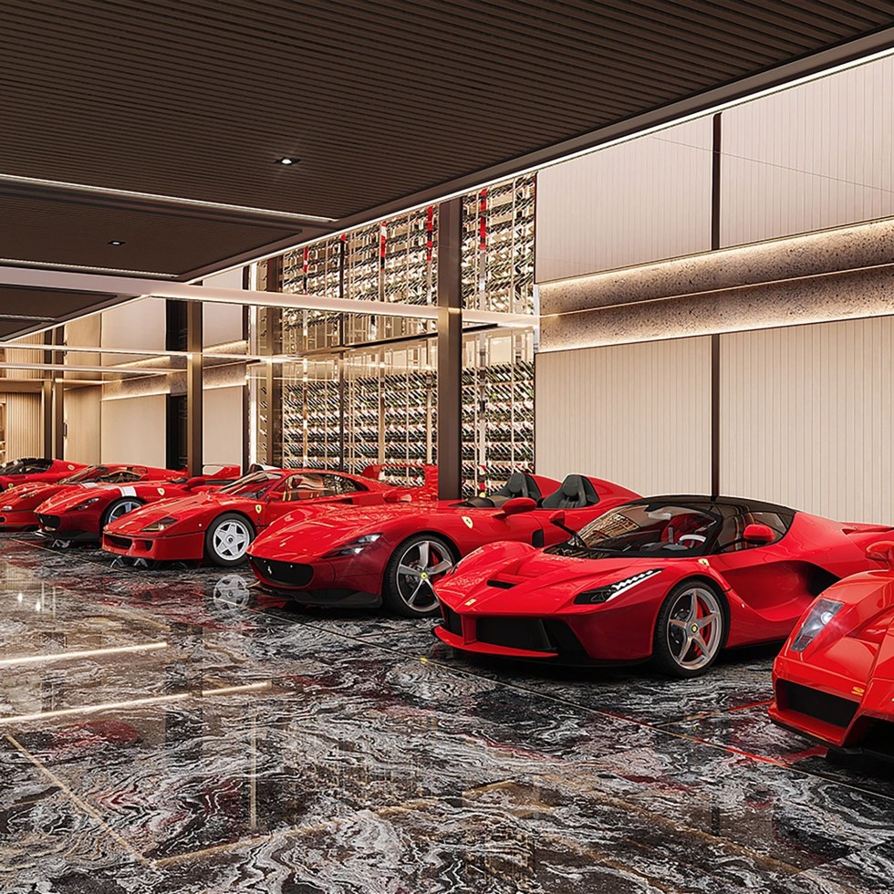 Fabulous private garage filled with red Ferrari supercars.