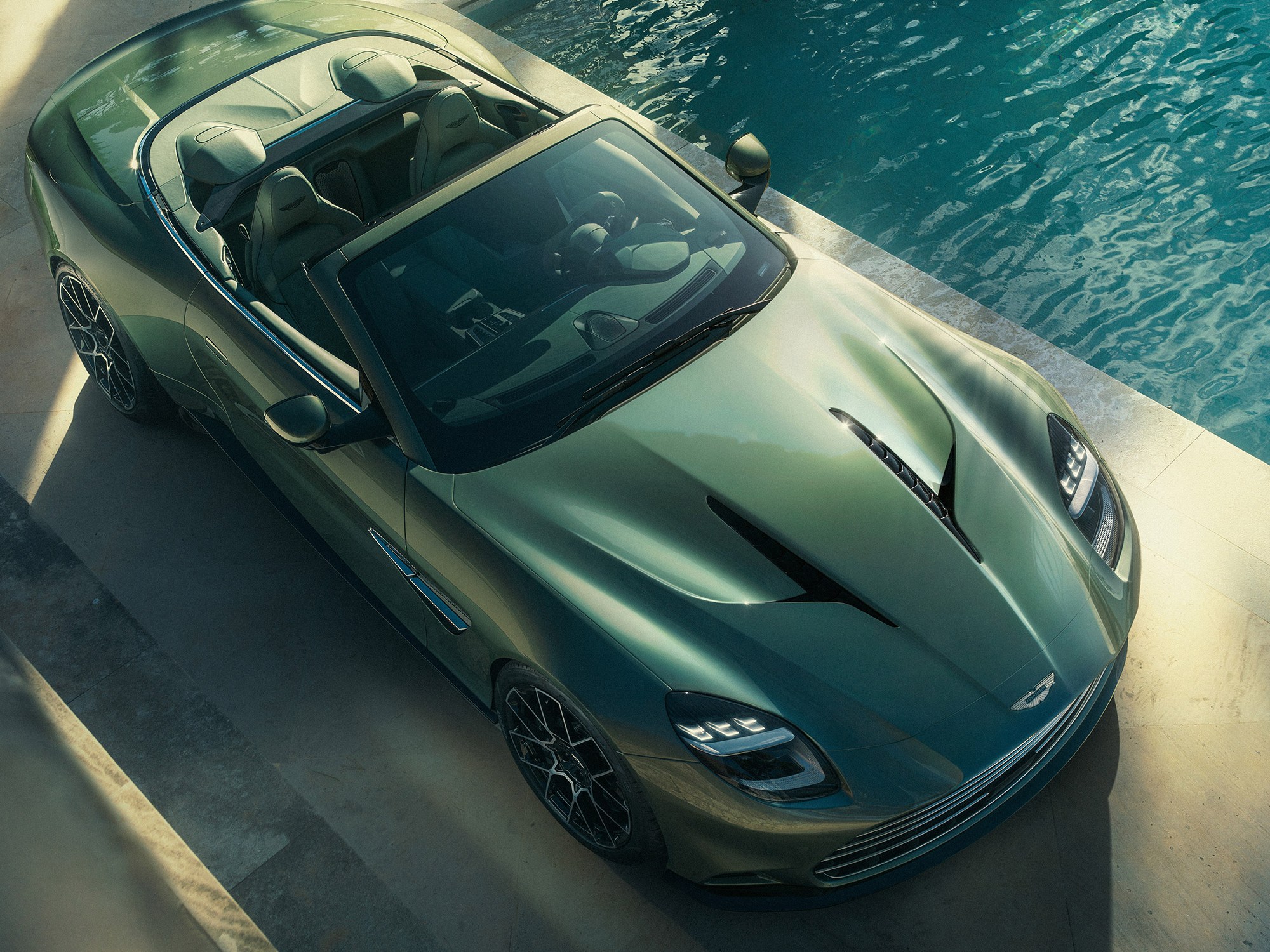Aston Martin Vanquish Volante parked by the Pool