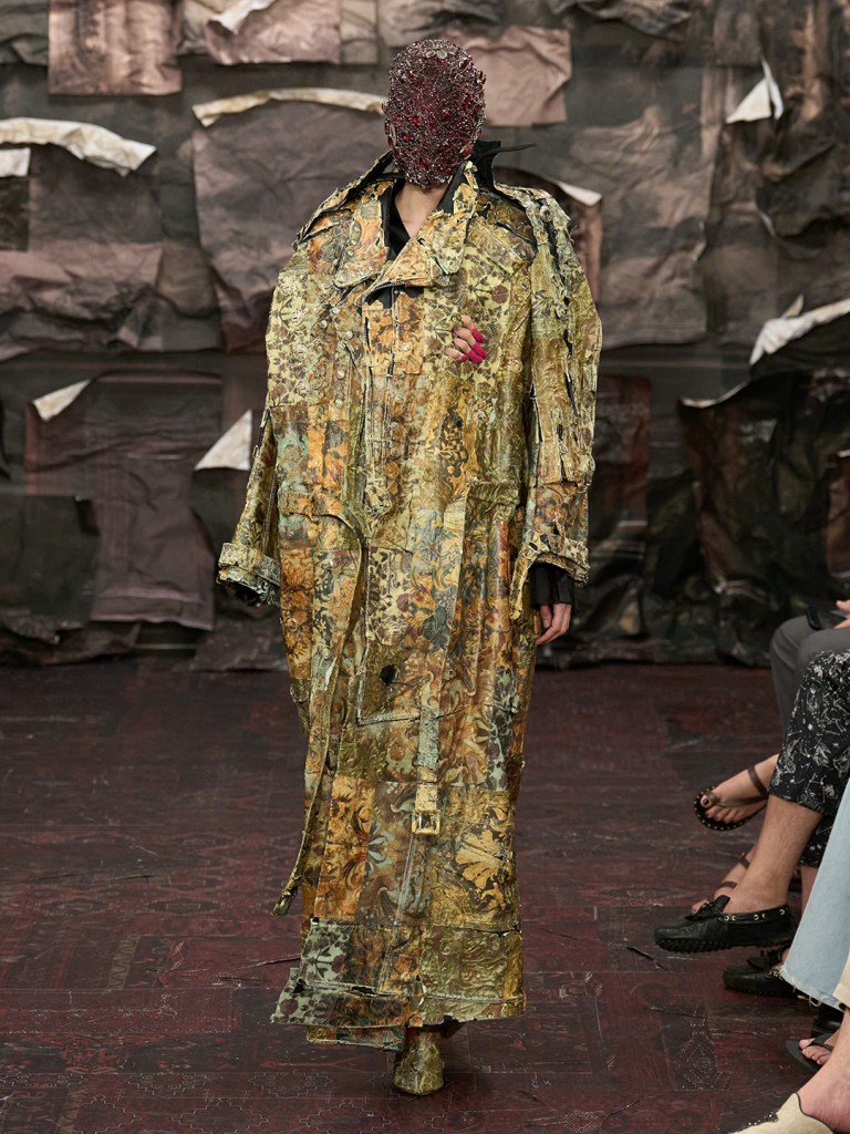 catwalk model presenting maison margiela collection at the paris fashion week