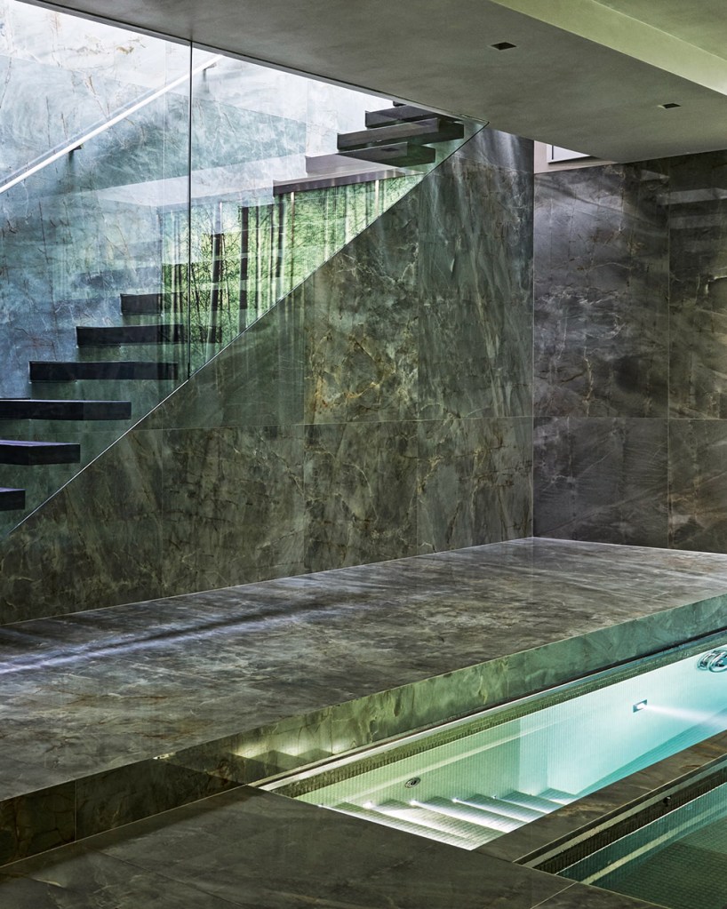 Underground swimming pool with stairs in natural green malachite stone.
