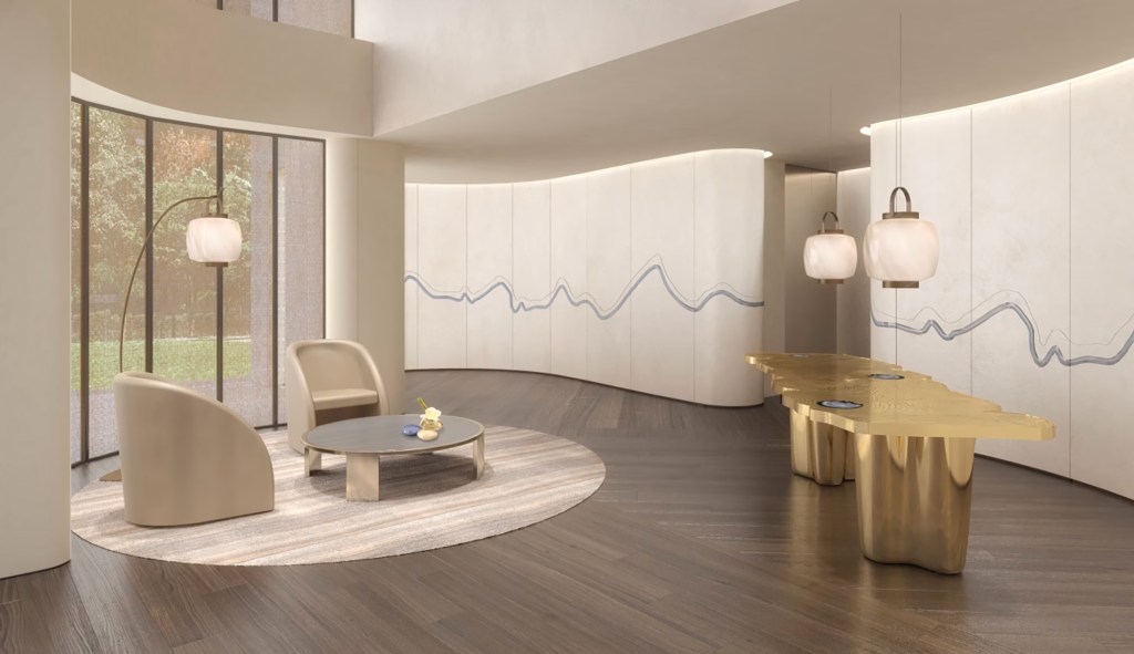 Open space with wooden floor, white walls, high windows, designer gold table and lounging furniture.