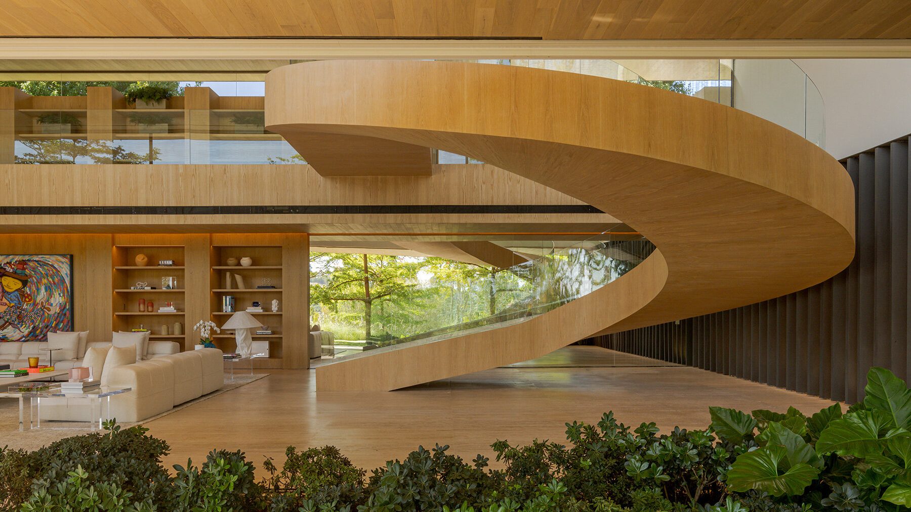 Luxurious modern interior with a sweeping wooden spiral staircase as a centerpiece. Warm tones, large windows, indoor plants, and abstract art create an inviting, elegant atmosphere.