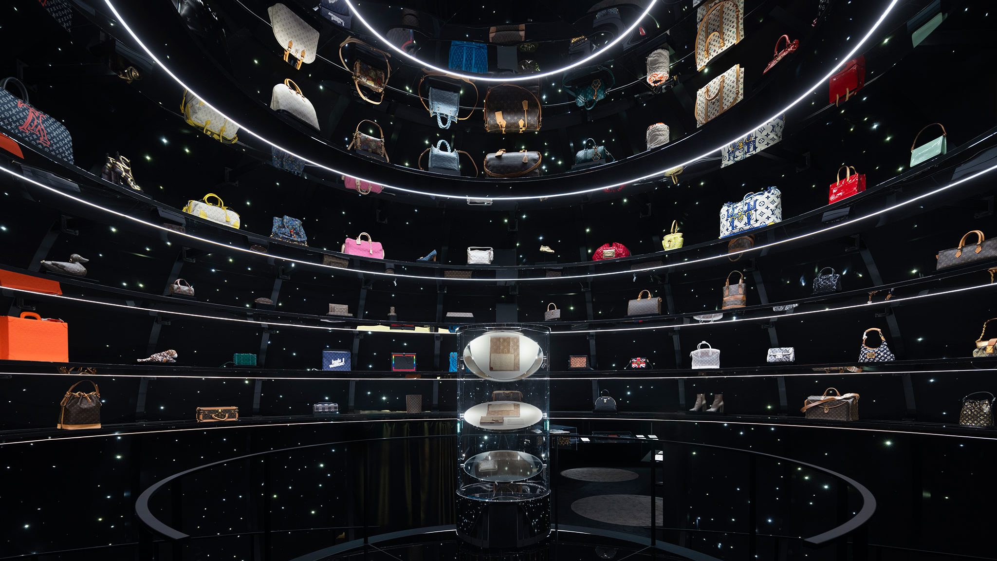 A room showcasing a variety of vintage Louis Vuitton bags in different styles and colors.