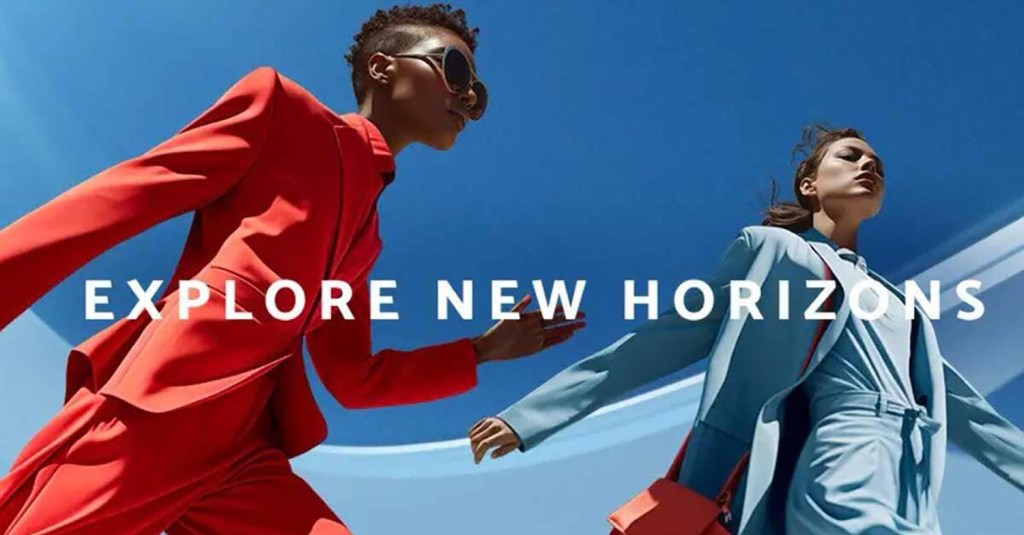 Two individuals, one in a vibrant red suit and the other in a light blue suit, stride forward confidently against a blue sky. Text reads "Explore New Horizons."