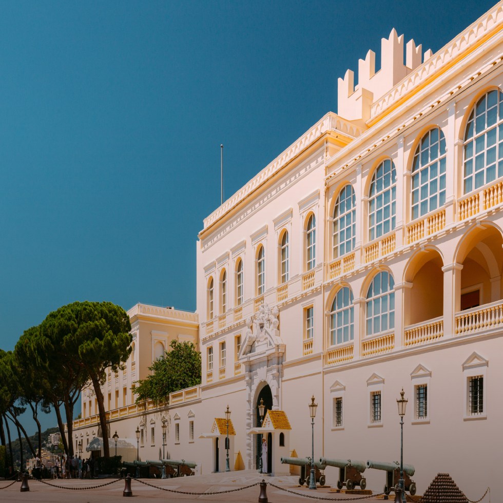 monaco royal palace exterior on a sunny day with blue sky
