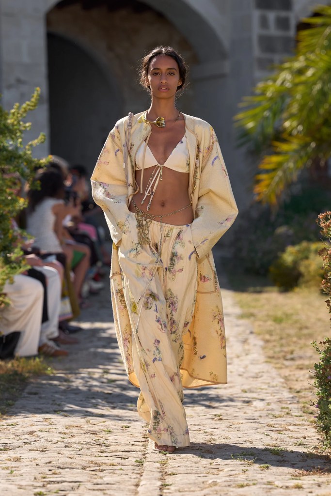 Alémais model wears sandy colour panys and bikini bra with a long robe