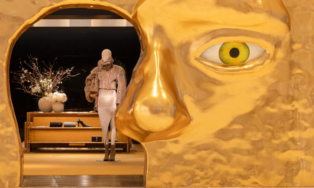 Schiaparelli gold half face and keyhole boutique entrance