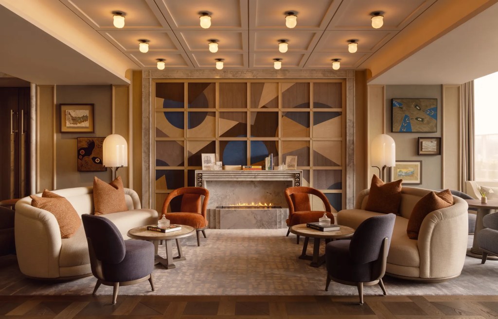 capella taipei living room with colorful furniture and fireplace