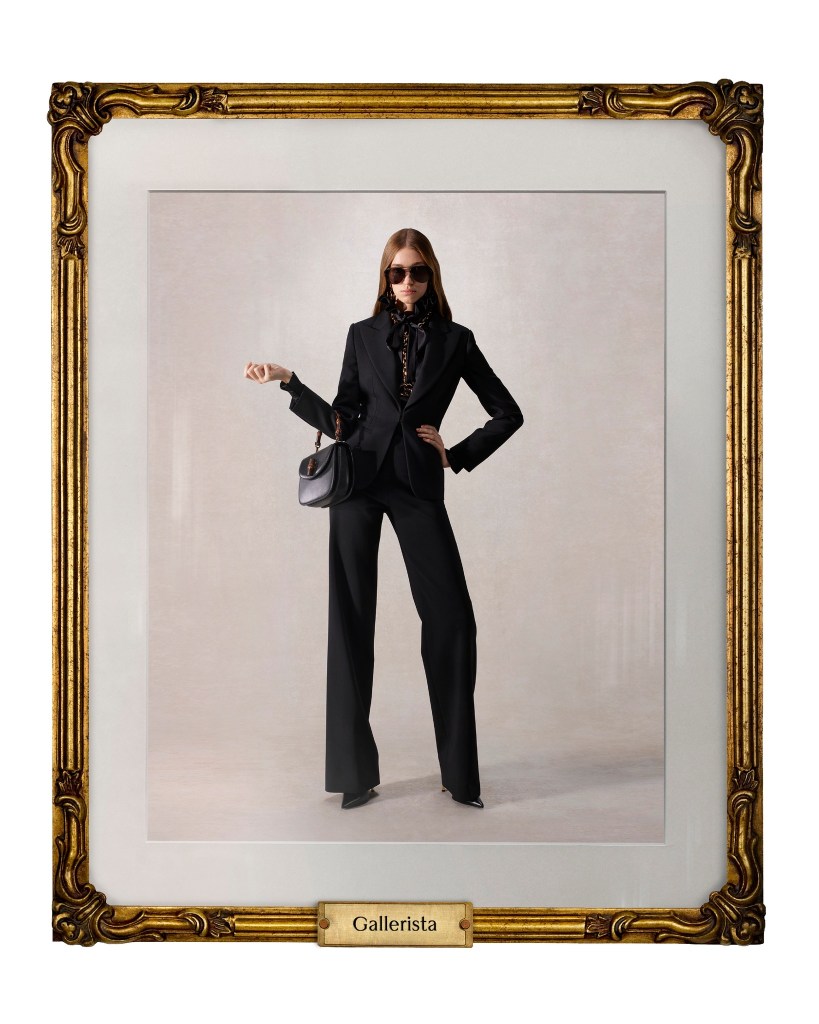 Gallerista Gucci models wears a black suit and sunglasses by Demna