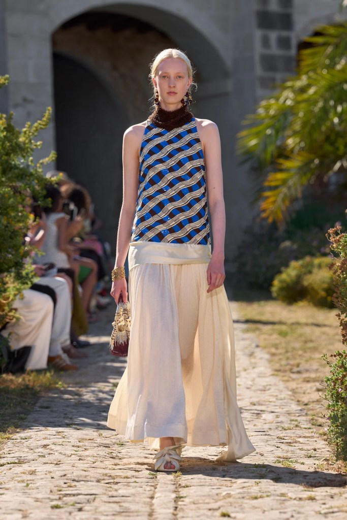 Alémais model wears long summery dress in beige and blue