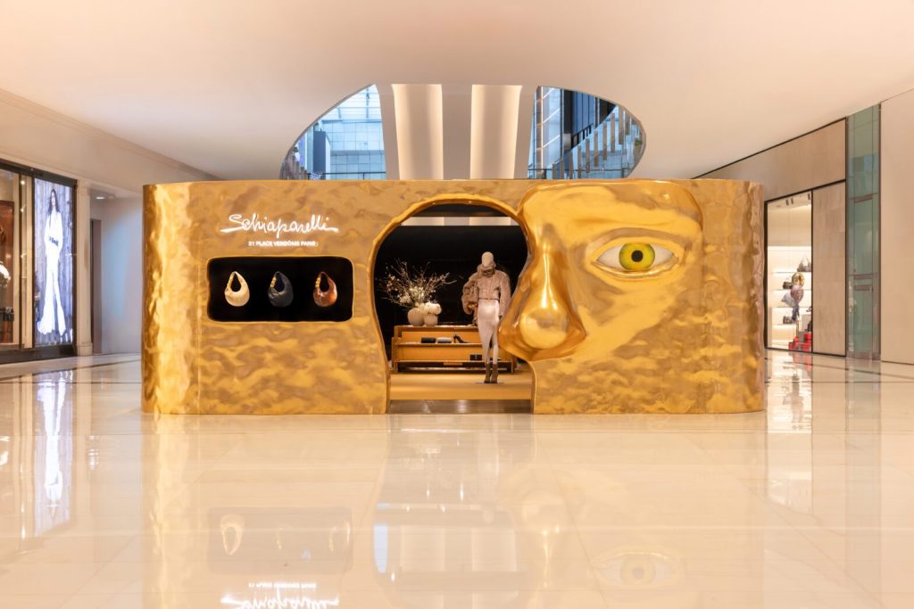 Schiaparelli gold storefront in the middle of the shopping centre