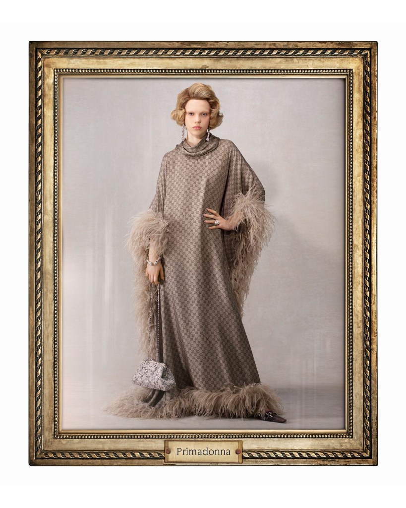 Model wears Gucci pattern cardigan by Demna with feather trimming