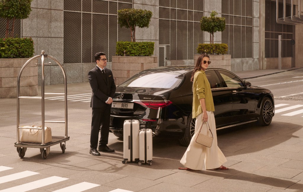 vip female customer enjoying a personal concierge service by wheely luxury car transfers in dubai