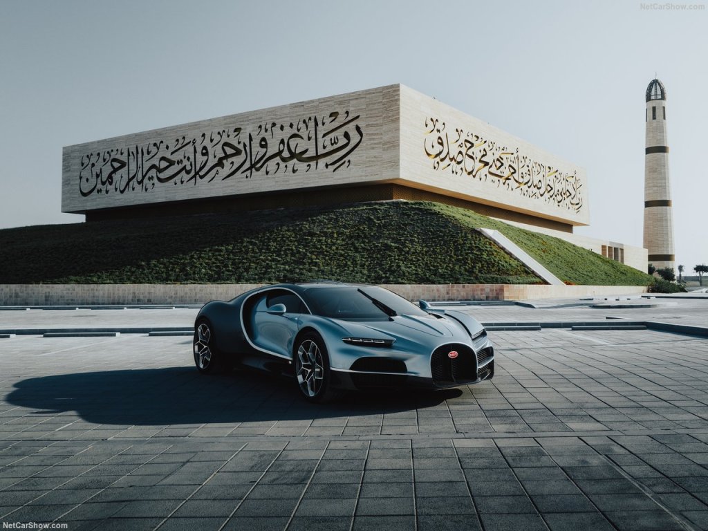 Bugatti Tourbillon parked on the backdrop of the arabic writing wall in middle east