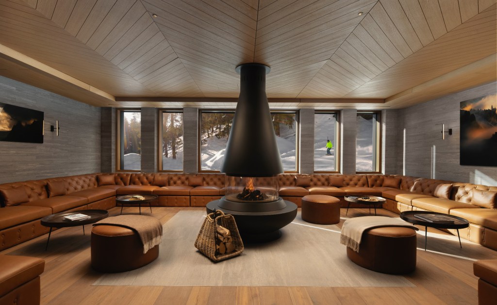 Modern lounge with central fireplace.