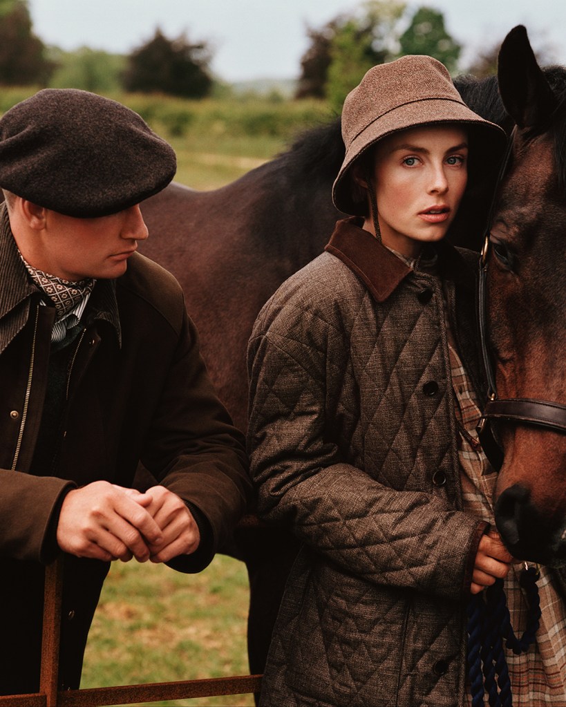 Man looks at woman and horse at the countryside.