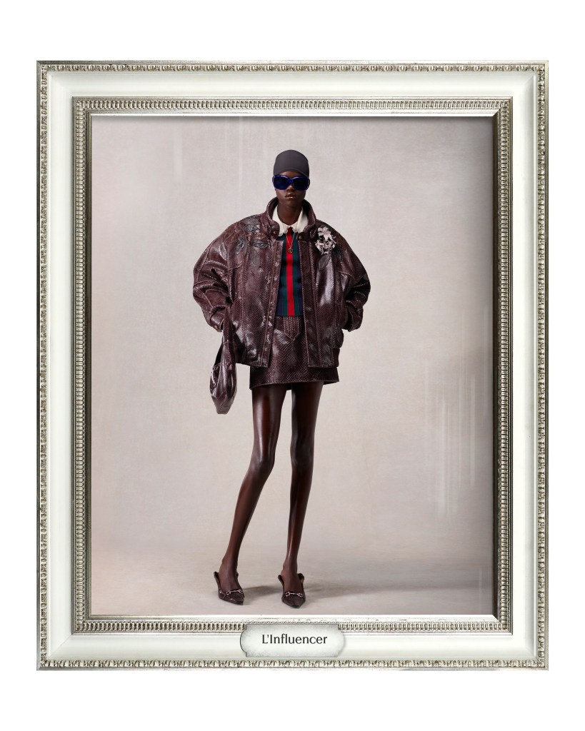 L'Influencer black model wears leather puffy jacket and mini skirt by Demna