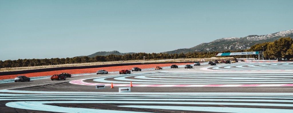 Cars racing on colourful Paul Ricard Experience circuit