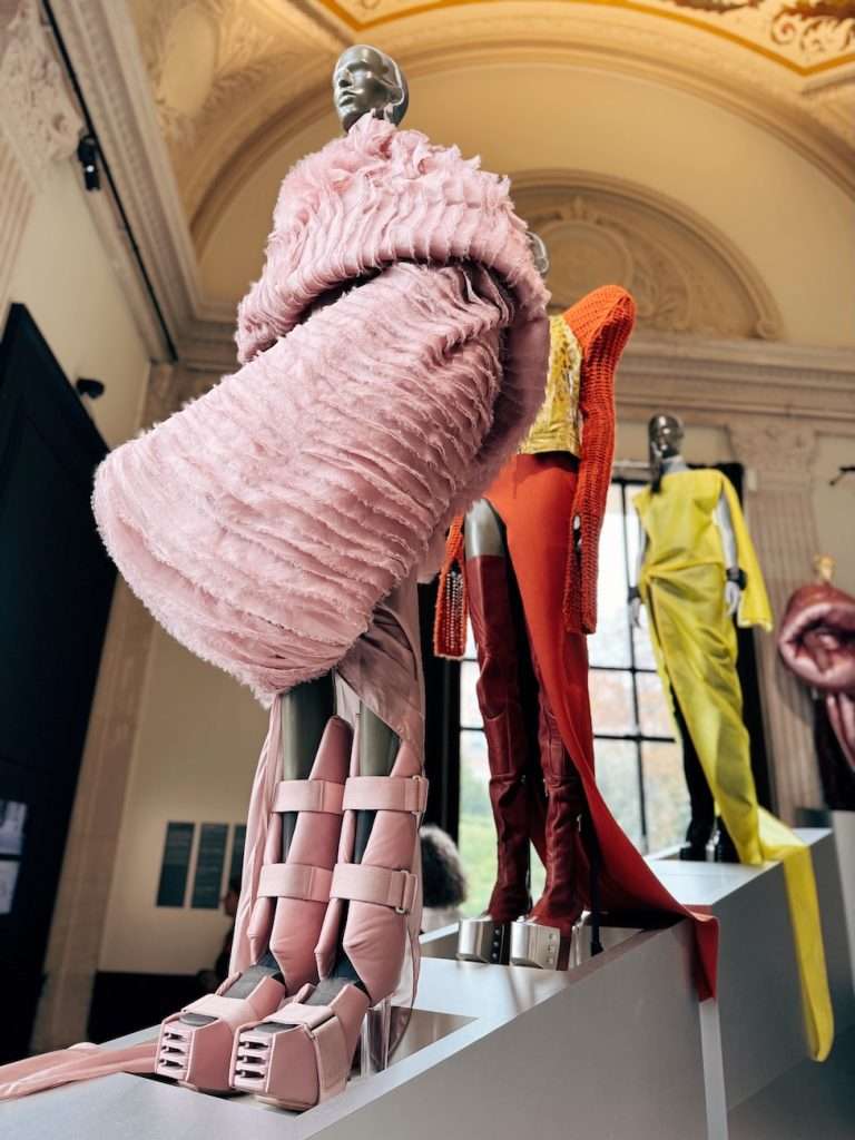 Rick Owens exhibition in Paris featuring light baby pink satin garment and boots