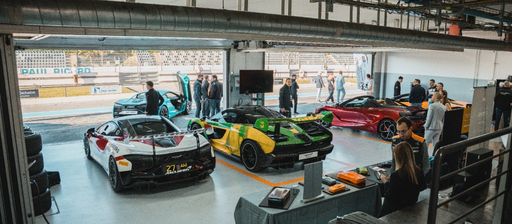 McLaren cars in a racing garage.