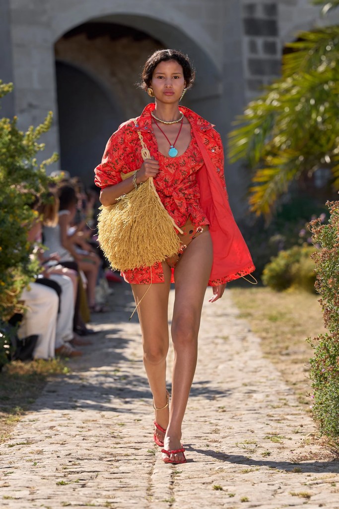 Alémais model wears orange summer outfit