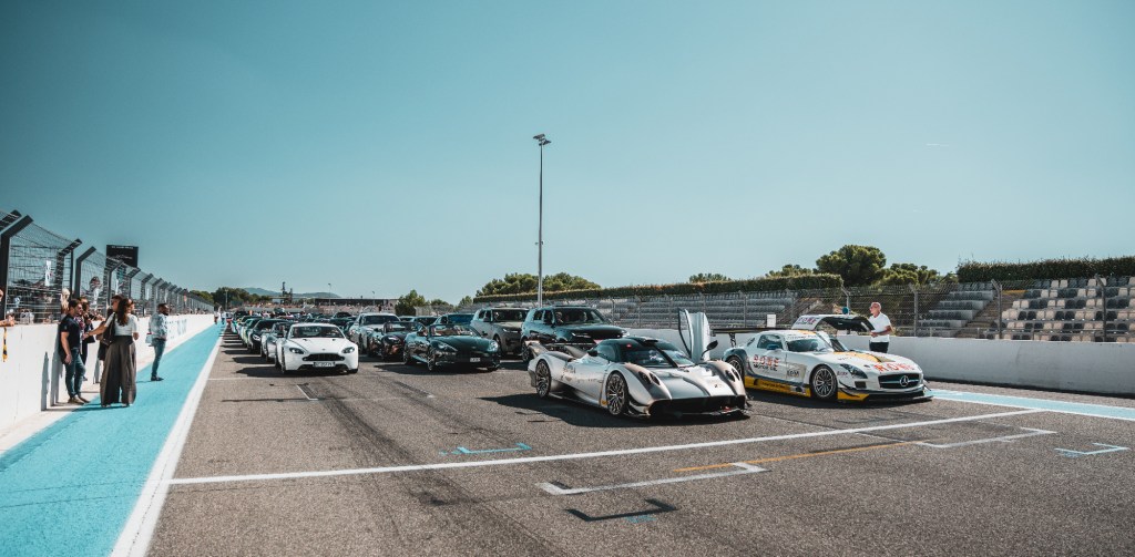 Lineup of luxury hypercars at circuit