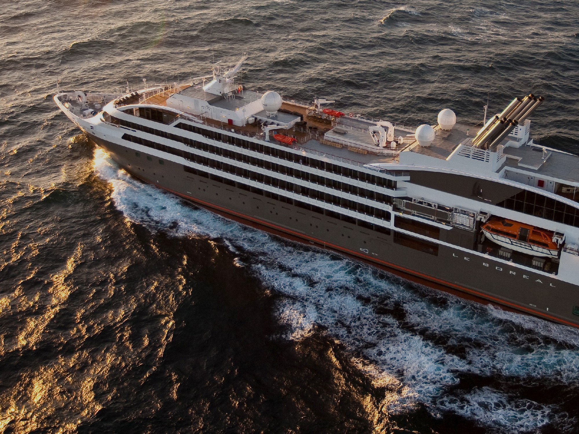 Ponant luxury cruise ship Le Boreal at the sea sunset
