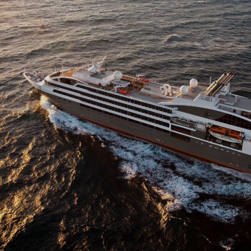 Ponant luxury cruise ship Le Boreal at the sea sunset