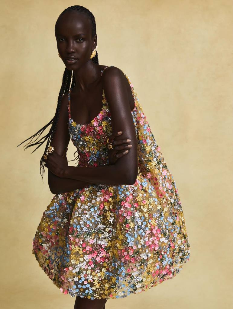 Oscar de la Renta multicolor floral dress worn by a beautiful black female model with braids