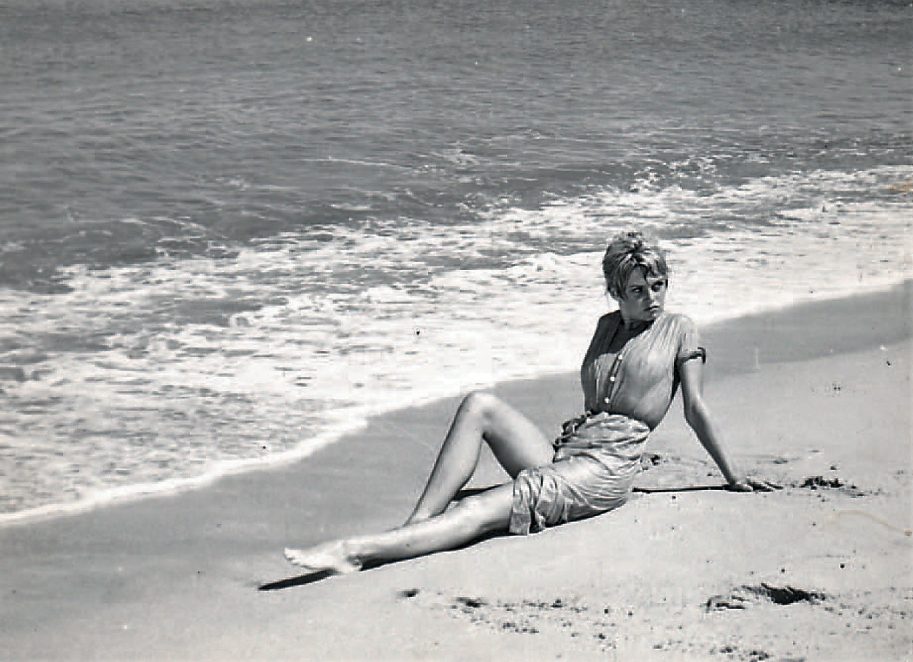 Brigitte Bardot in a wet Pierre Balmain dress for the movie "And God created woman"