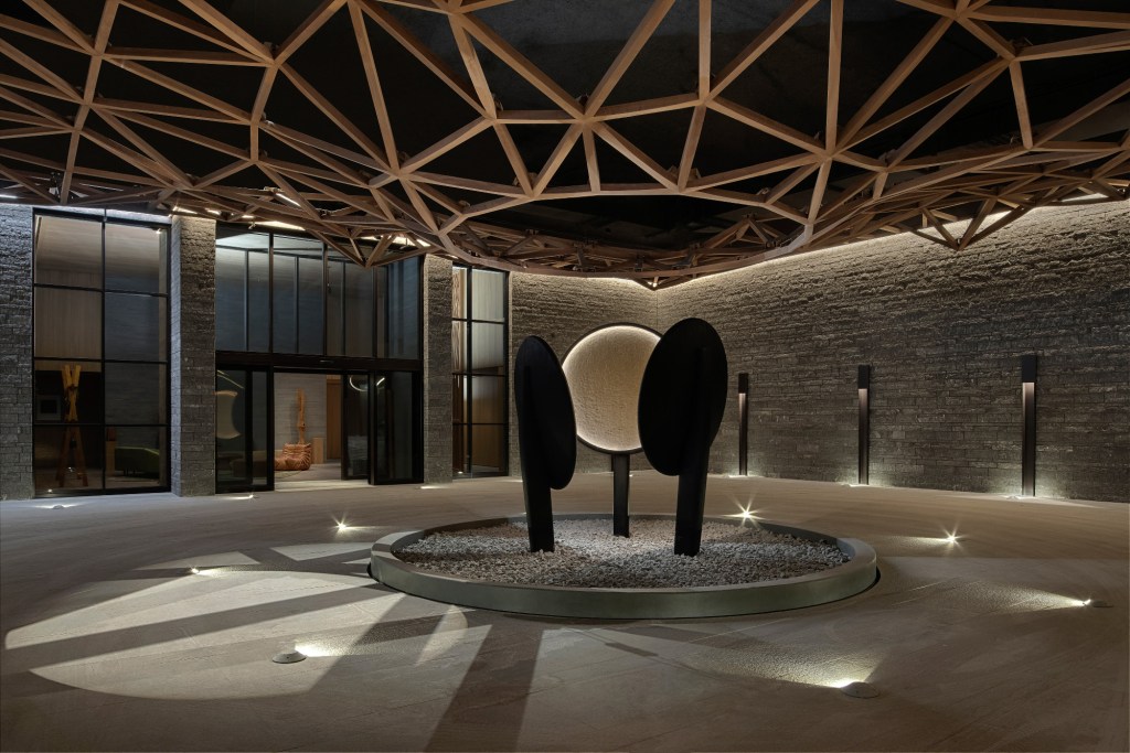 Modern entrance with artistic sculptures.