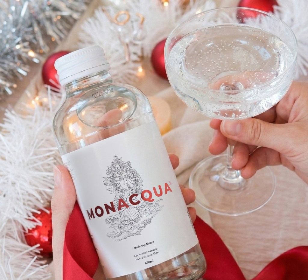 monacqua sparkling water in a crystal champagne glass