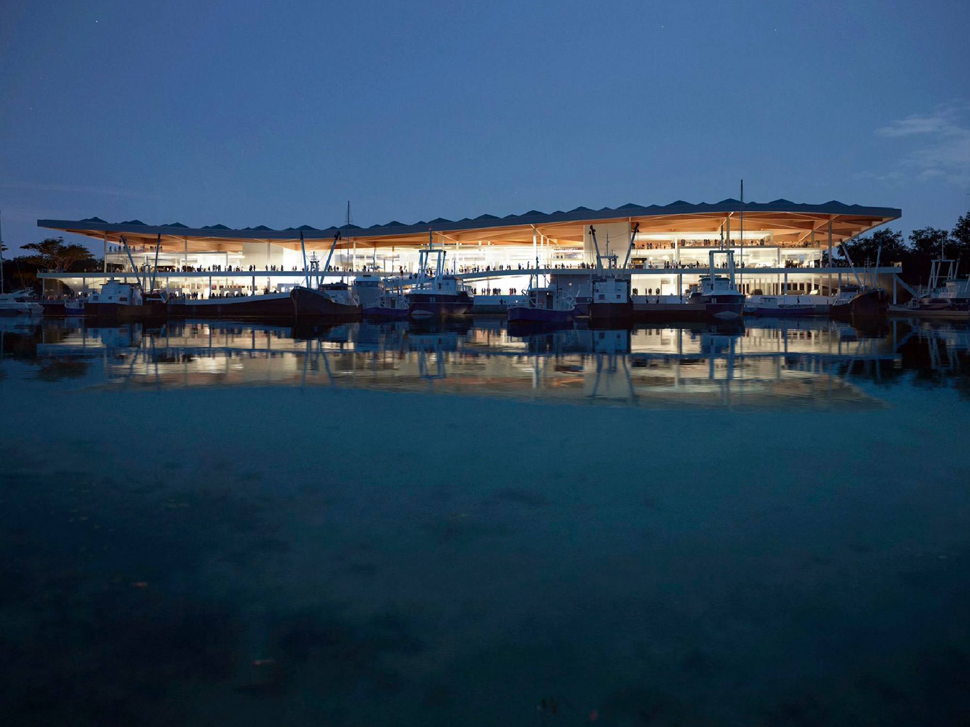 Sydney Fish Market building by the water at night