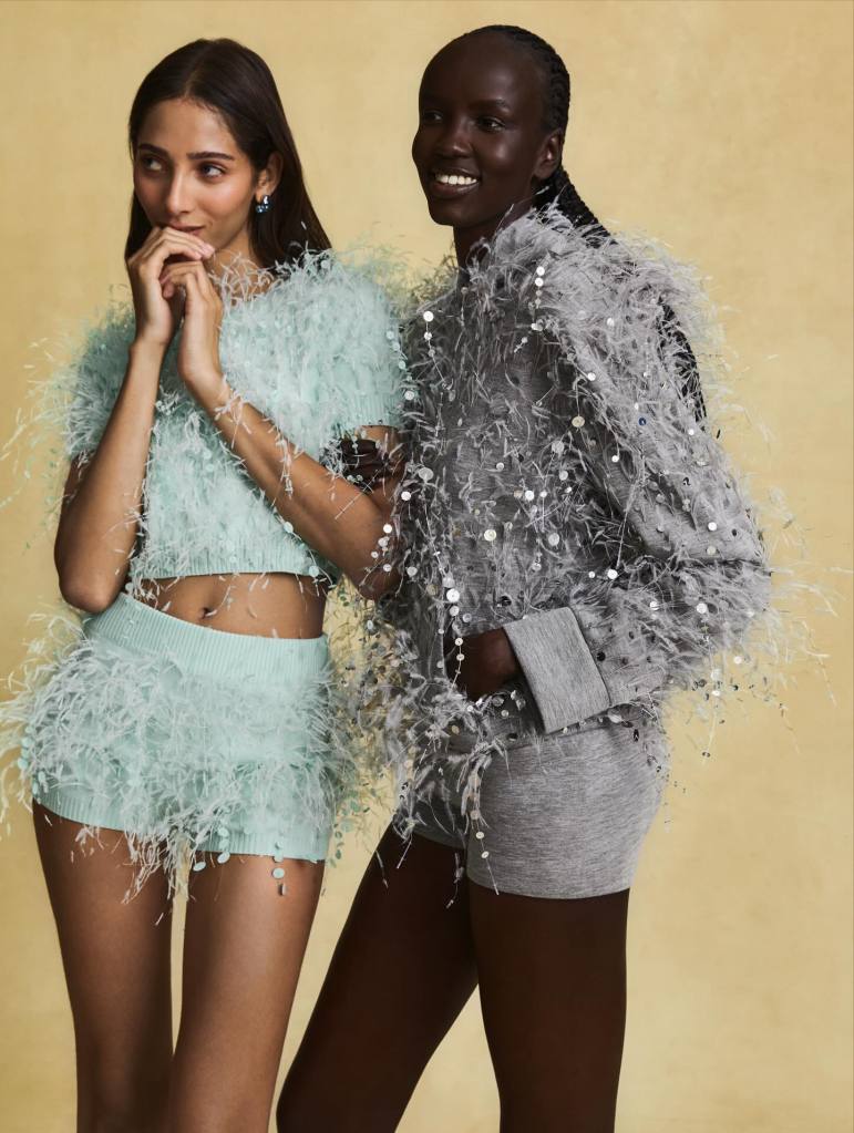 Oscar de la Renta fashion models wearing soft an fluffy ensemble in baby blue and light grey made out of feathers