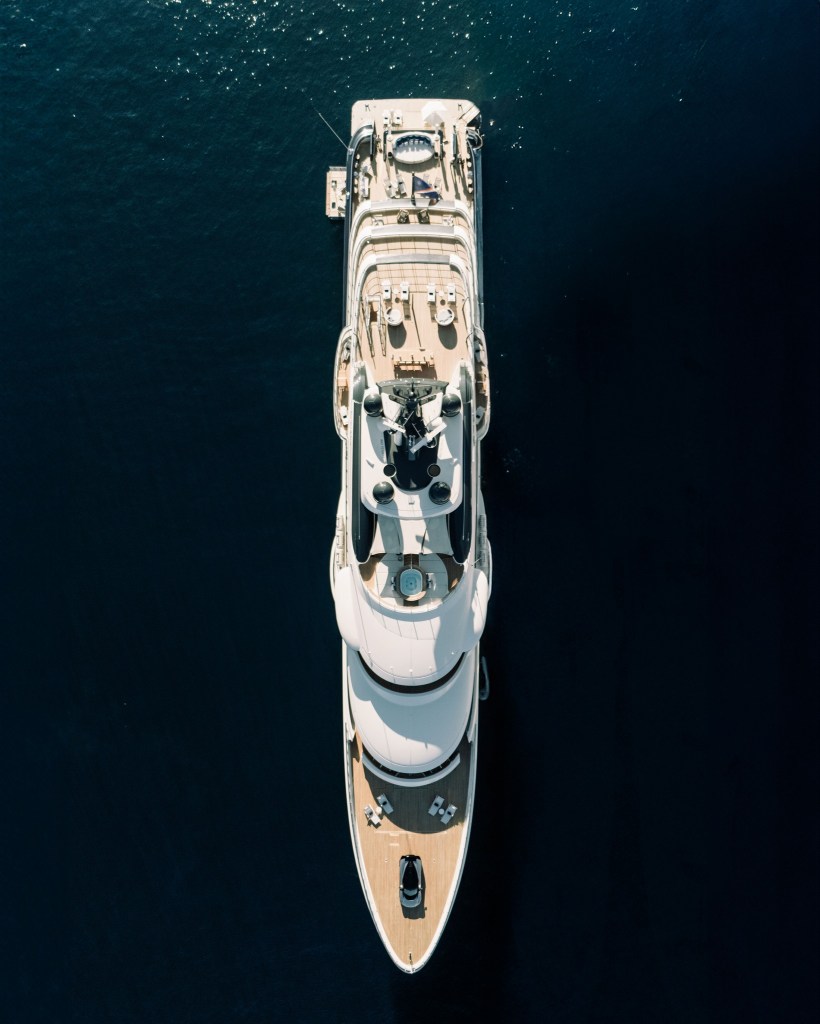 Luxurious superyacht on calm waters.