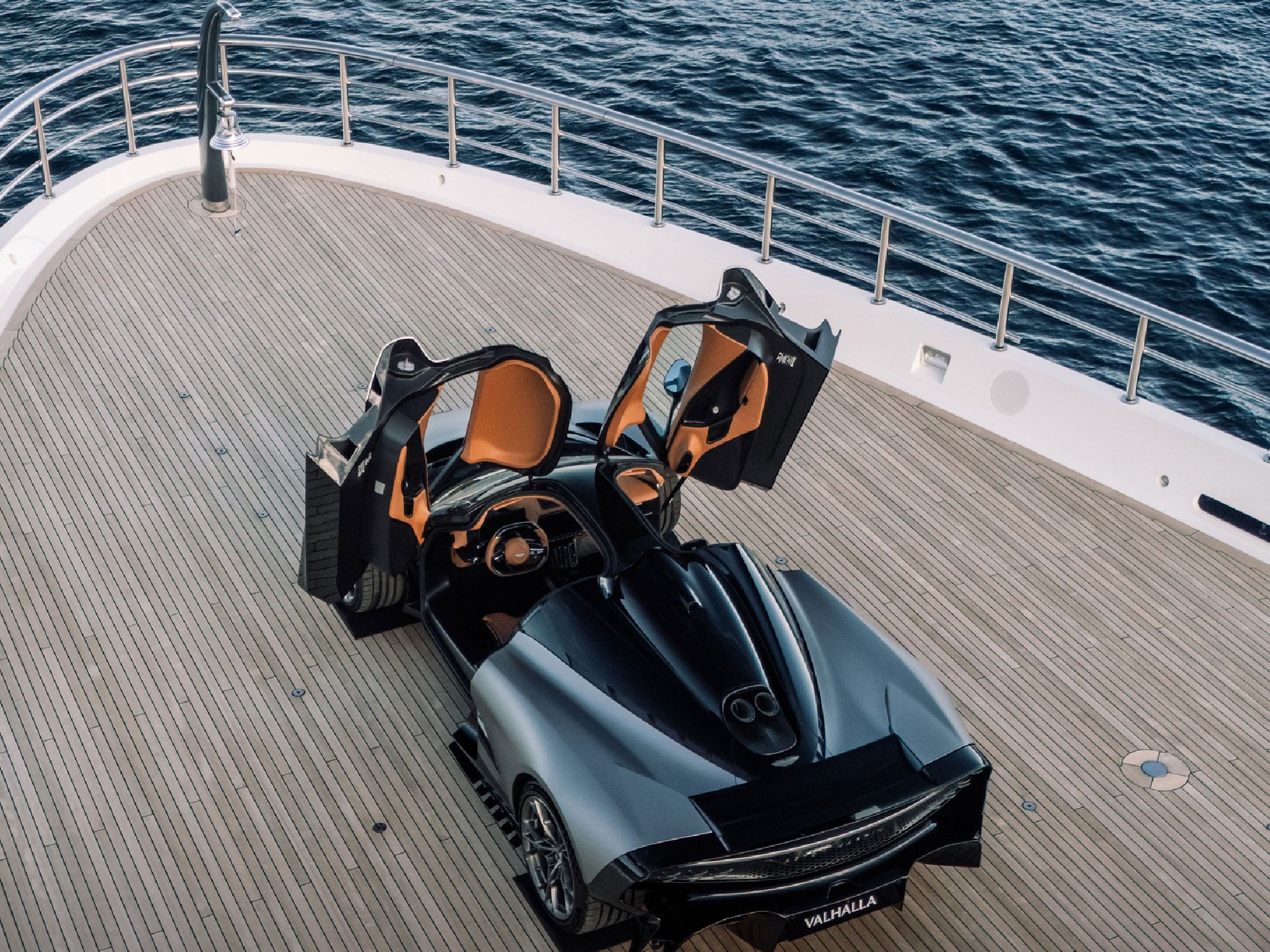 Valhalla supercar with gull-wing doors open onboard a superyacht