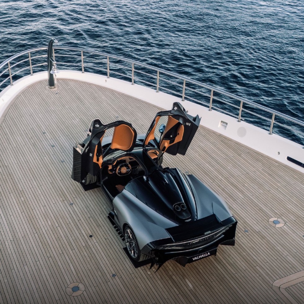 Valhalla supercar with gull-wing doors open onboard a superyacht