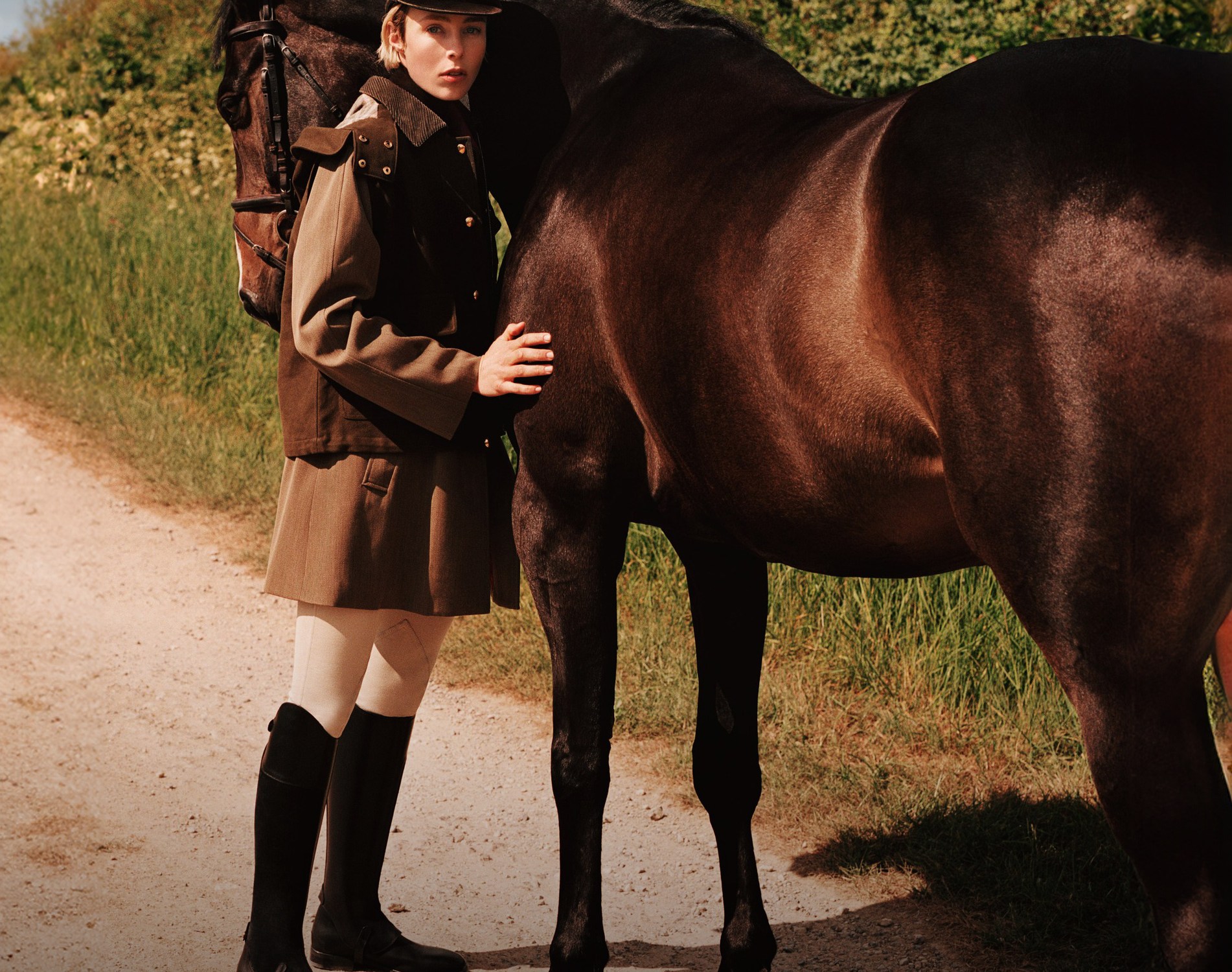 Loro Piana Highlands campaign featuring a woman with a brown horse.