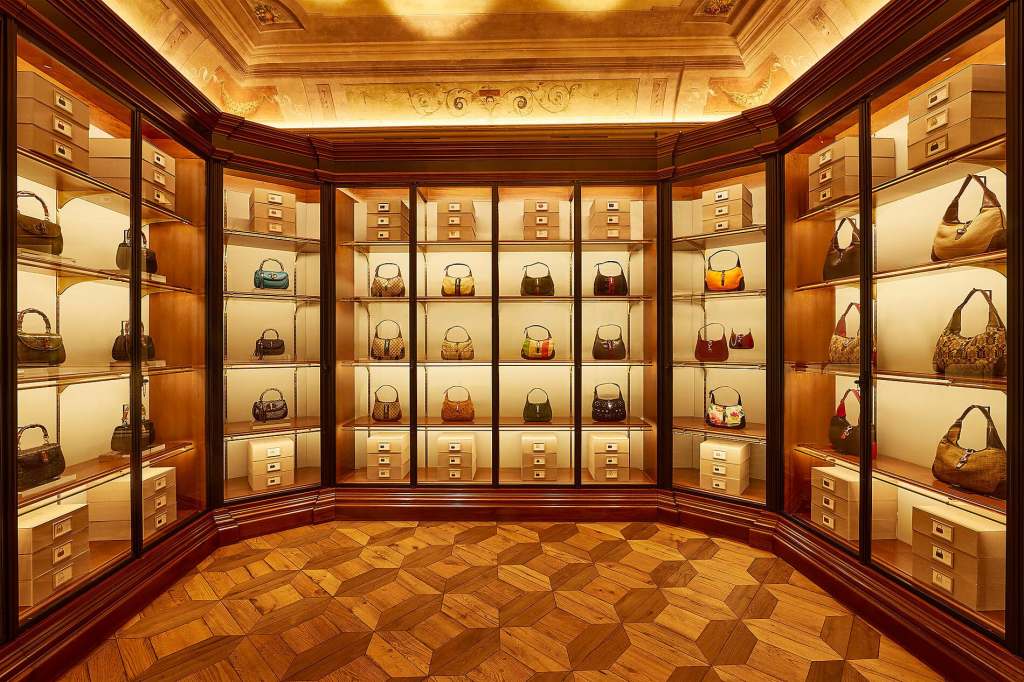 Gucci walk in wardrobe filled with luxury baga