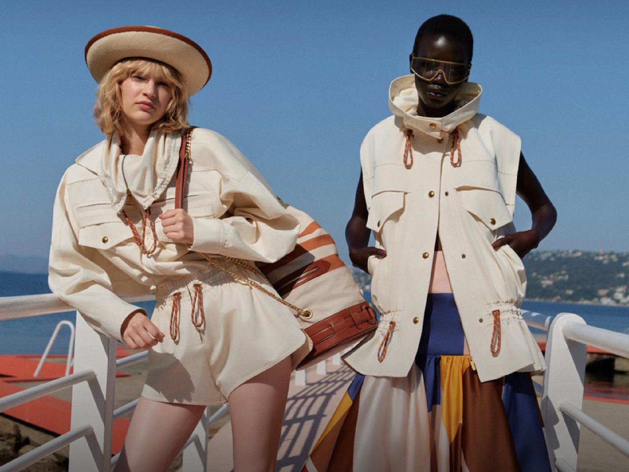 one blond and one African model wearing Zimmermann at cap d'antibes event