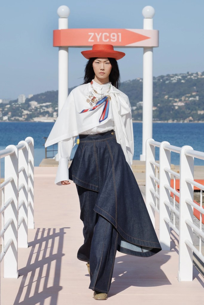 asian runaway model at Zimmermann fashion show in white chemise and jean skirt